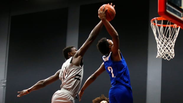 Jan 7, 2021; Phoenix, AZ, USA; Prolific Prep's Yohan Traore (14) attempts to block a dunk from Eduprize Academy's Devontes Cobbs (2) during the first half at the PHHacility basketball gym. Mandatory Credit: Patrick Breen-Arizona Republic Phhacility Basketball Gym
